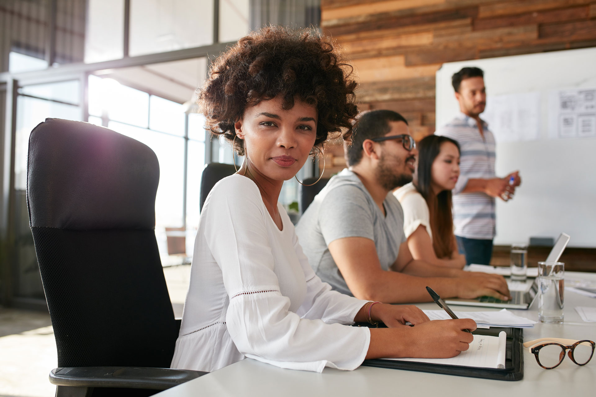 confident-businesswoman-sitting-at-a-business-PPDZBVF.jpg